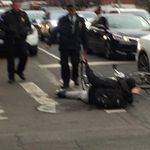 An NYPD officer shoves a bicyclist off his bike to give him a ticket, according to a witness.